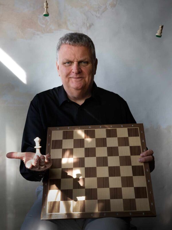 Dr Karsten Wagner - Consulting for Dental - posing with chess pieces